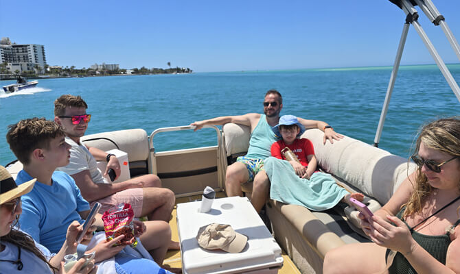 Enjoying private boat tour with family on Sarasota Bay waters