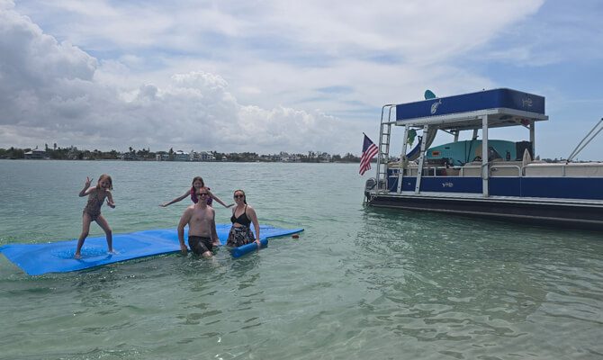 Anchoring boat with waterslide deployed at Siesta Key sandbar