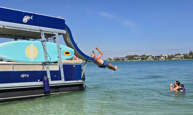 Sliding down boat waterslide during Siesta Key charter